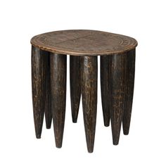 three wooden stools stacked on top of each other in the shape of four legs