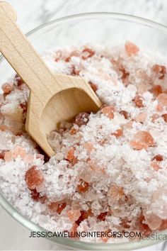 a wooden spoon in a bowl filled with sugar