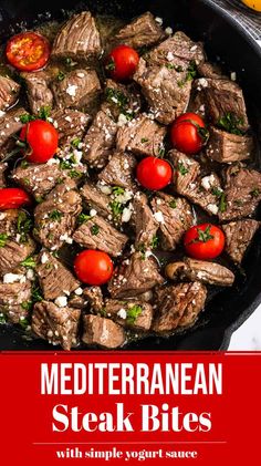 steak bites in a skillet with tomatoes and parsley on the side, ready to be eaten