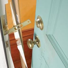 an open door with a handle on the front and side of it, next to a closed door