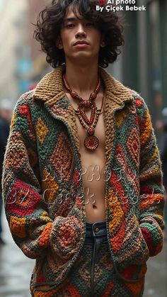 a man with no shirt wearing a multicolored sweater and jacket on the street