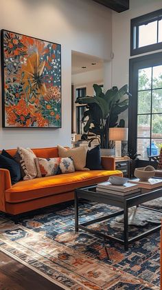 Modern and cozy living room with orange couch, decorative pillows, abstract art, green plants, and contemporary furniture Jewel Colored Living Room, Mix And Match Couches Living Rooms, Contemporary Eclectic Living Room, Jewel Tone Living Room, Stylish Living Room Ideas, Modern Classic Living Room, Statement Walls, Patterned Cushions, Dynamic Artwork