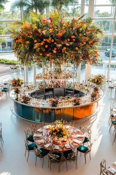 Elegant Wedding Bar with Luxe Hanging Florals – This stylish city wedding bar features a bold floral chandelier in orange, yellow, and burgundy. A statement piece that brings sophistication to any urban event! City Wedding Decor, Modern City Wedding, Hanging Florals, Yellow And Burgundy, Tall Floral Arrangements, Floral Chandelier, Wedding Reception Inspiration, Wedding Entertainment, Beautiful Centerpieces