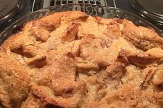 a pie sitting on top of an oven next to two burners