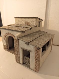 a model of a building made out of clay