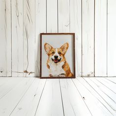 a dog in a wooden frame hanging on a white painted wall with wood planks