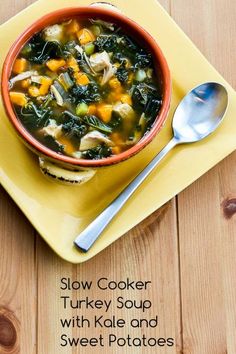 a bowl of turkey soup with kale and sweet potatoes is on a yellow plate