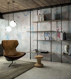 a chair and table in a room with concrete walls