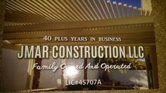 an advertisement for a construction company in front of a building with the words, 40 plus years in business