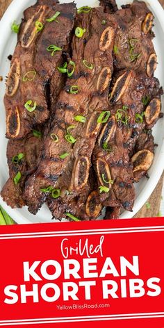 korean short ribs on a white plate with green garnish and the words grilled korean short ribs