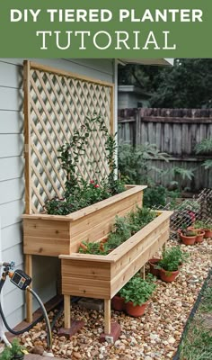 a wooden planter filled with lots of plants