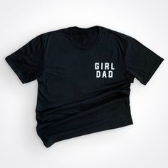 Girldad® Logo on the left chest to show off that Dad bod! Mens Perfect Tri-Blend Crew Tee *Three yarns form the perfect blending of softness while providing an easygoing look * 50/25/25 poly/combed ring spun combed cotton/rayon, 32 singles * Tear-away tag * Tri-Blend fabric infuses each garment with unique character. Please allow for slight color variations. Mens Sizes S-4XL Black Shirt With Text Print For Family, Personalised Gifts Diy, Girl Dad, Shirt Girl, Girls Shirt, Dad Day, Logo Shirt, Fathers Day Crafts, Fathers Day Shirts