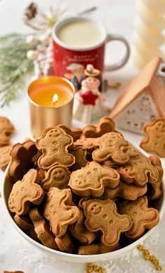 a white bowl filled with cookies on top of a table