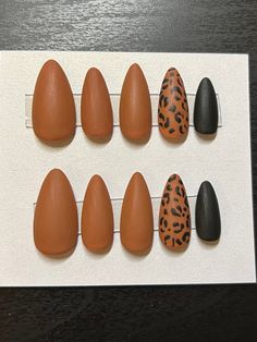 Brown and black is used to create this leopard print set of nails. Finished with a matte coat, this is the perfect neutral set with a pop of interest. This design is shown on  medium almonds.  Each set comes with nail glue, a mini buffer block, a cuticle pusher and an alcohol wipe for optimal prep before applying the nails. All products used are Beetles gel polish brand. Avoid inhalation, ingestion, and eye contact. If irritation or allergic signs occurs, stop use immediately. If signs persist, Burnt Orange Cheetah Nails, Fall Leopard Print Nails, Black And Brown Nails, Animal Print Nail Designs, Beetles Gel Polish, Gel Polish Brands, Matte Black Nails, Leopard Print Nails, Nail Candy