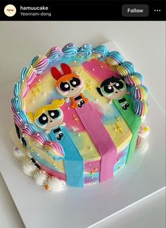 the cake is decorated with cartoon characters on it