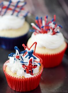 three cupcakes decorated with red, white and blue icing