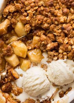 a close up of food on a plate with ice cream and nuts in it's center