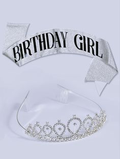 a tiara with the words birthday girl in black and white on it's side