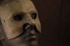 a close up of a mannequin's head with a mask on it