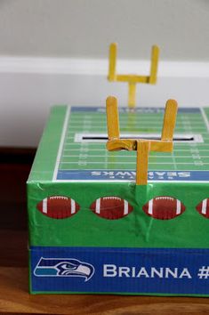 a cardboard box that is shaped like a football field