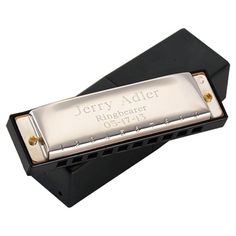 a harmonica with the name jerry adler on it