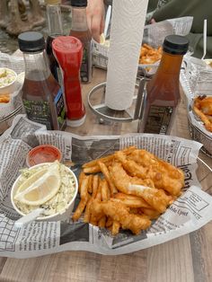 fish and chips are served in baskets on the table