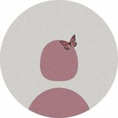 a pink and white circle with a butterfly on the top, in front of it