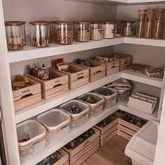 an organized pantry with bins and baskets