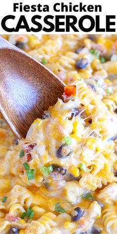 a wooden spoon scooping out some mexican chicken casserole from a skillet