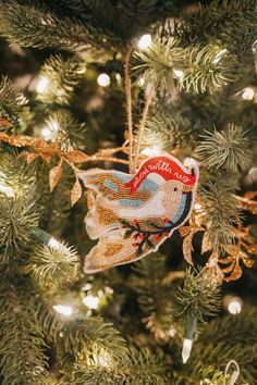 a christmas ornament hanging from a tree