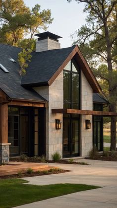 a modern house with stone and wood accents