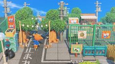 an animal crossing the street in front of some shops and stores with animals on them