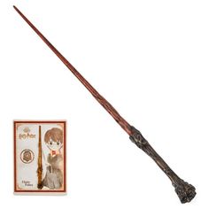 harry potter's wand with its box and stick on it, next to an image of hermiko