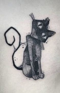 a black and white cat tattoo on the chest