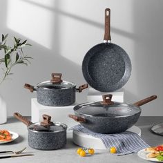 an assortment of pots and pans on a table