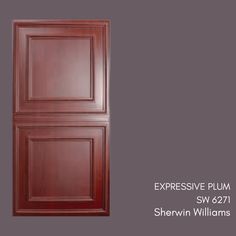 an image of a door with the words expressive plum painted in brown on it