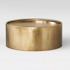 a gold ring on a white background