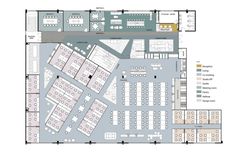 the floor plan for an office building with several tables and seating areas, including two desks