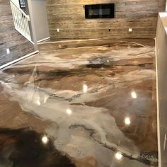 a kitchen floor that has been painted with metallic paint and some lights on the top