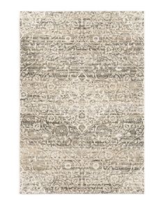 an area rug in beige and grey tones