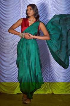 Green pre-draped saree with bandhani print pattern. Paired with red V neck blouse.
Component: 2
Pattern: Printed
Type Of Work: Bandhani
Neckline: V neck
Sleeve Type: Sleeveless
Fabric: Silk
Color: Green
Other Details: 
Note: Belt worn by the model is not for sale
Occasion: Sangeet - Aza Fashions Concept Saree, Red Silk Blouse, Pink City, Vacuum Storage, Drape Saree, Ready To Wear Saree, Indian Wedding Wear, Green Saree, Lehenga Saree