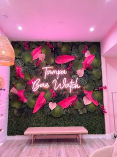 there is a pink wall in the room with flowers on it and a sign that says tampa blvd