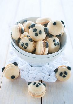 a bowl filled with cookies covered in panda bears