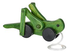 a green wooden toy car with black wheels on a white background and cord attached to it