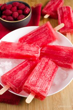 raspberry popsicles on a plate with ice