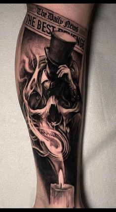 a man's leg with a tattoo on it and a candle in the middle