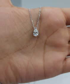 "This is a beautiful Lab Grown diamond design pendant. It is set in real solid 14Kt Gold and the chain is 14Kt Gold as well.  You can choose if you want 14Kt White Gold, 14Kt Yellow Gold or 14Kt Rose Gold.  We have a lot of beautiful jewelry with natural diamonds. If any listing states \"diamond\" then it is a natural diamond. If the listing states \"Lab Grown\" it is a Lab Grown diamond. The chain goes through so that the diamond sits comfortably on you when you wear it. This is the perfect gift for mom, wife, fiancee, girlfriend, valentine, daughter, family or friend. It is a special gift for mother's day, valentine's day, wedding, anniversary, birthday, Christmas, Easter, New Year's and any holiday. Pendant Size: 8.65mm (0.340 inches) x 5.25mm (0.207 inches) Diamond weight: 0.72 carats Pear-shaped White Gold Solitaire Necklace For Anniversary, Anniversary Solitaire Diamond Necklace With Lab-grown Diamond, Solitaire Teardrop Pendant Necklace With Brilliant Cut For Anniversary, Gift Solitaire Drop Necklace With Prong Setting, Teardrop Solitaire Necklace With Brilliant Cut For Anniversary, Pear Shaped Diamond Cut Solitaire Necklace For Anniversary, Cubic Zirconia Teardrop Solitaire Necklace For Anniversary, Pear-shaped Diamond Necklace As Gift, Gift Solitaire Necklace With Pear Diamond Accents