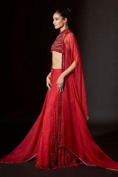 Red silk organza cape with crystal embellishments. Comes with net sharara and a crop top with big stone work. - Aza Fashions Bollywood Style Red Sharara For Evening, Red Bollywood Style Sharara For Evening, Red Bollywood Sharara For Evening, Red Sharara With Dupatta For Evening, Red Organza Party Set, Red Evening Set With Sheer Dupatta, Festive Red Evening Sets, Red Sharara With Sheer Dupatta For Party, Red Organza Sharara With Unstitched Blouse