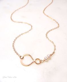 "Dainty Beaded Freshwater Pearl Necklace ~ Available in Rose Gold or Sterling Silver A simple and dainty infinity necklace - So simple and modern! - Small infinity link measures about 19mm - Genuine dainty and genuine freshwater pearls - Chain is a shimmery 14k gold fill, rose gold fill or sterling silver chain - Loop has a tiny stamp of authenticity of sterling or 24k gold metal on one side - Total necklace length shown at 17\" - Model has a size small neck - Necklace closes with a dainty and s Infinity Necklace With Delicate Chain For Wedding, Infinity Necklace With Adjustable Chain For Wedding, Dainty Infinity Necklace For Wedding, Adjustable Infinity Necklace For Wedding, Delicate Infinity Chain Wedding Jewelry, Bridesmaid Jewelry Gift, Neck Necklace, Infinity Necklace Gold, Bridesmaid Gifts Jewelry