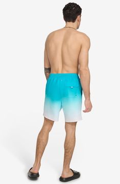 Seek out the gnarliest waves in ombré patterned swim trunks made from a fabric featuring built-in sun protection. 7" inseam Elastic/drawstring waist Side welt pockets; back flap-patch pocket UPF 40+ sun protection 100% polyester Machine wash, line dry Imported Upf 50+ Stretch Nylon Swim Trunks, Casual Multicolor Moisture-wicking Swim Trunks, Casual Moisture-wicking Multicolor Swim Trunks, Nylon Swim Trunks With 4-way Stretch For Beach, Multicolor Moisture-wicking Swim Trunks, Outdoor Running, Sports Blazer, Skirt Socks, Jogger Sweatpants